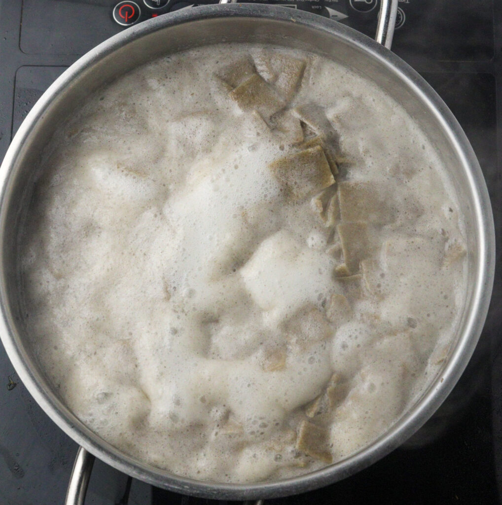 image of lazanki noodles in a pot of boiling water 
