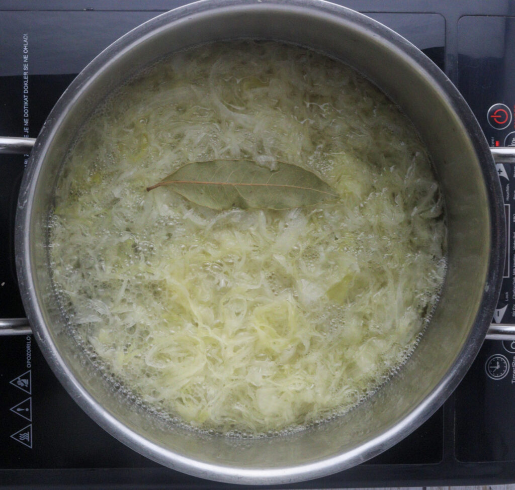 image of cooking cabbage with one bay leaf