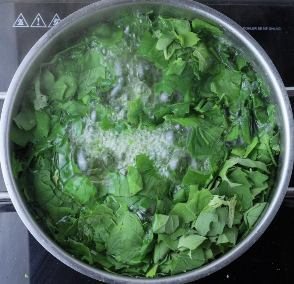 image of boiling wild spinach