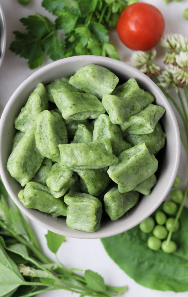 image of a bowl of green wild spinach gnocchi