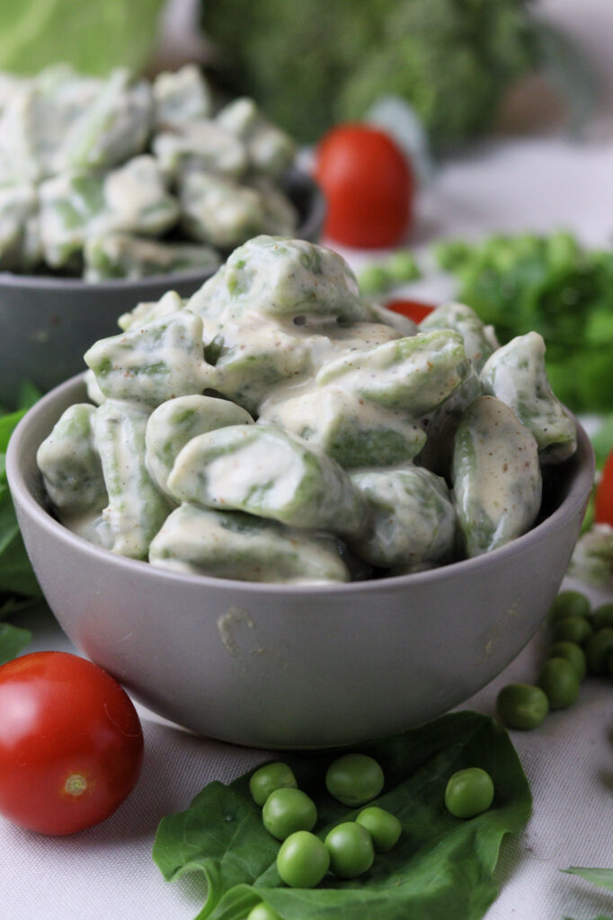 Image of green wild spinach gnocchi served with gorgonzola sauce