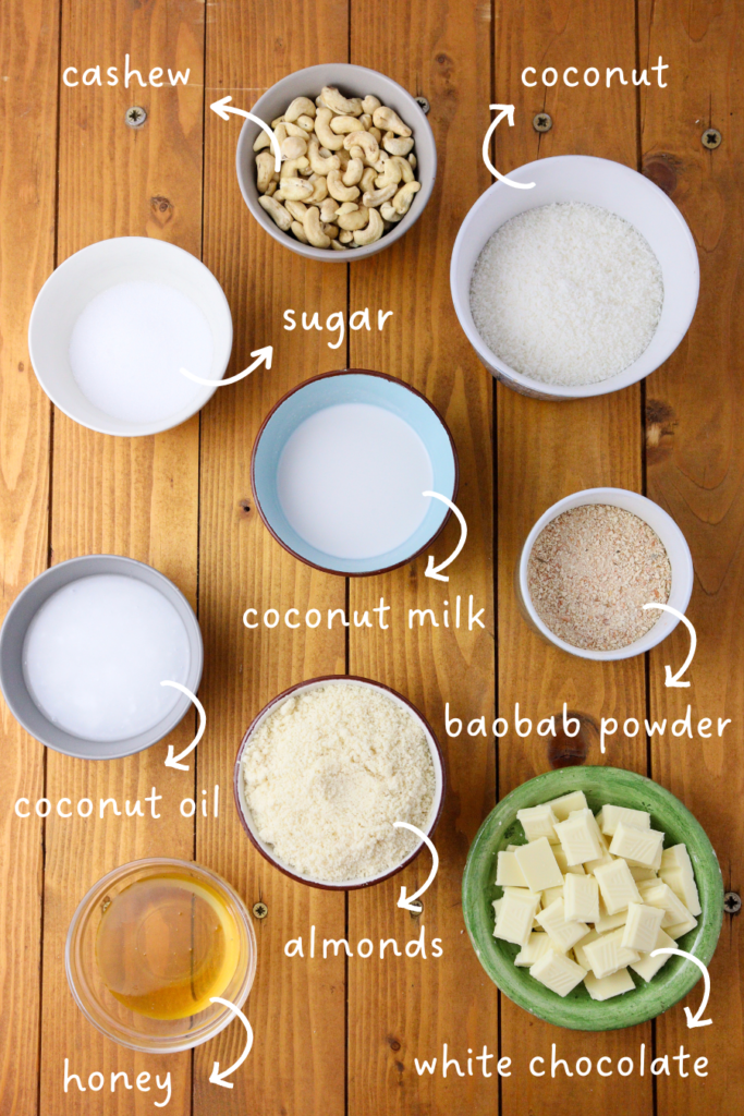 gathering ingredients for baobab bars: coconut, shredded almonds, cashews, coconut milk, coconut oil, honey, sugar and white chocolate